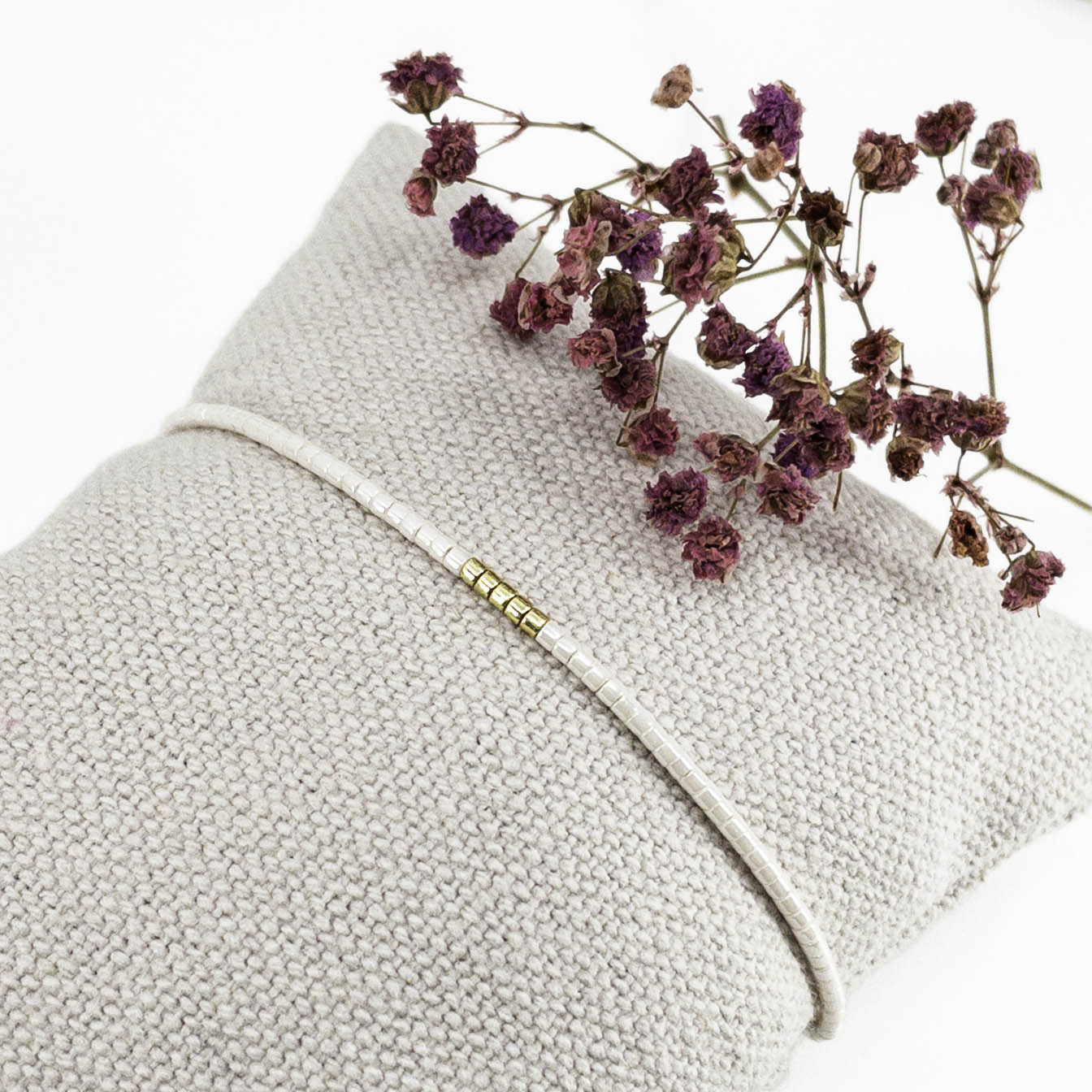 Bracelet en perles de rocaille ivoire et or