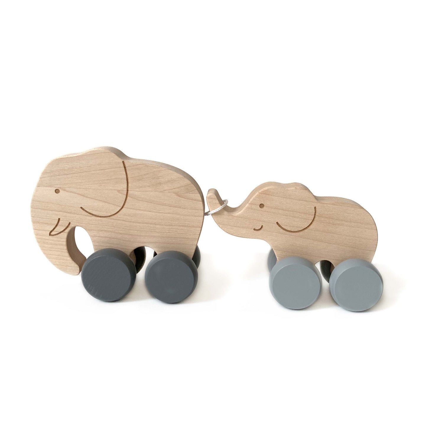 Jouet en bois à pousser composé d'une maman éléphant et de son petit. A partir d'un an.